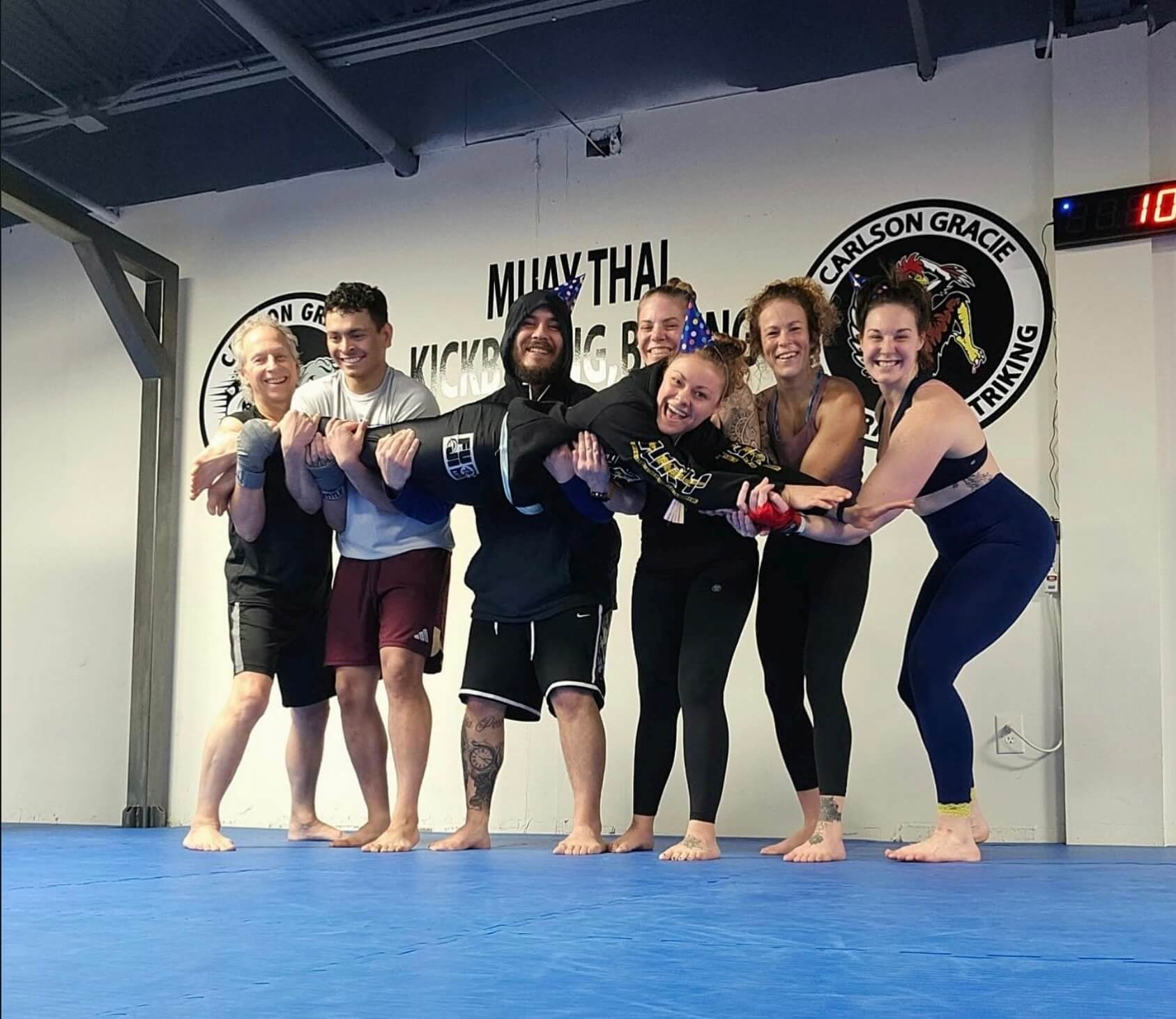 Carlson Gracie Grand Rapids boxing students sparring wearing gloves.