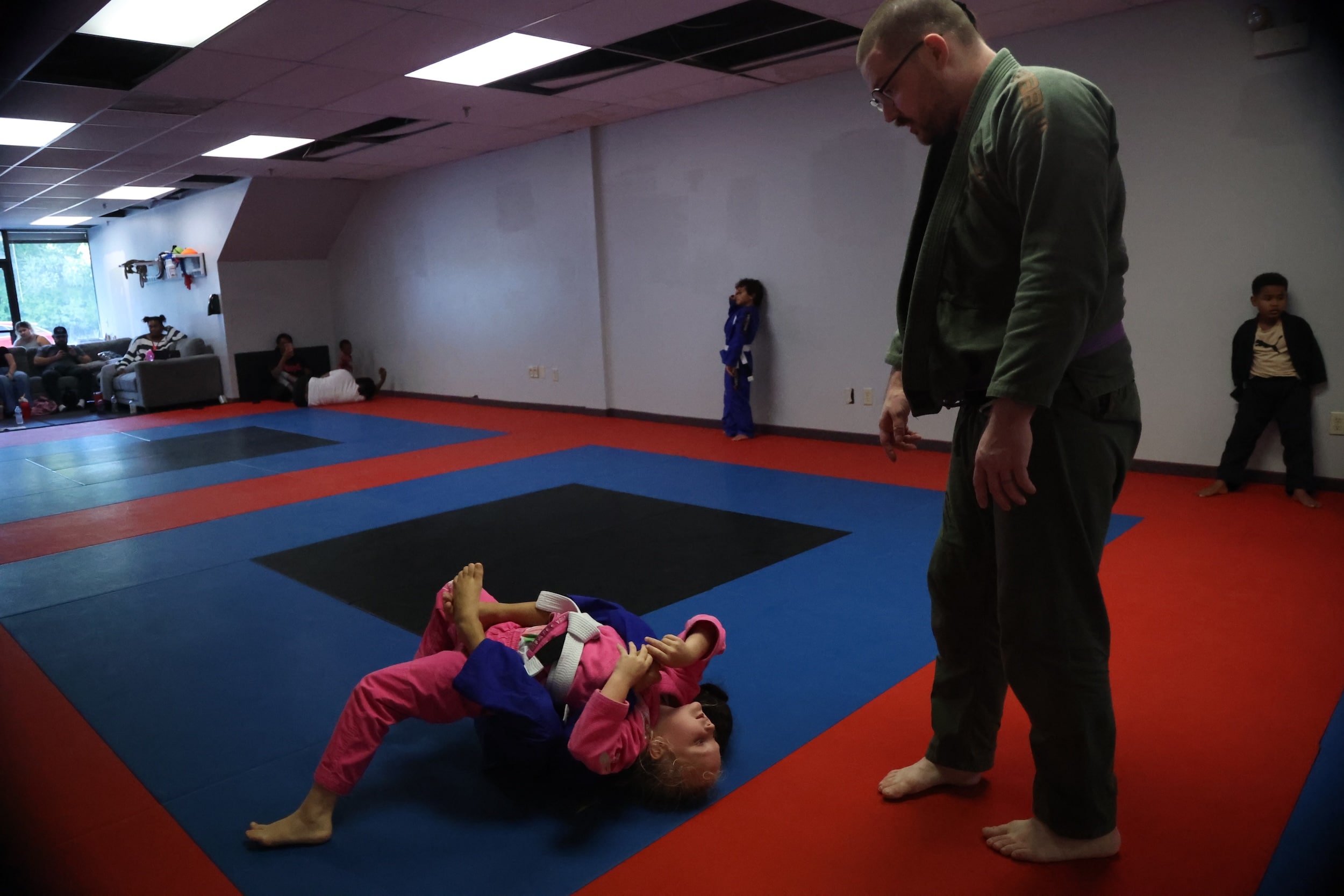 Carlson Gracie Grand Rapids young BJJ students grappling during youth jiu-jitsu class.