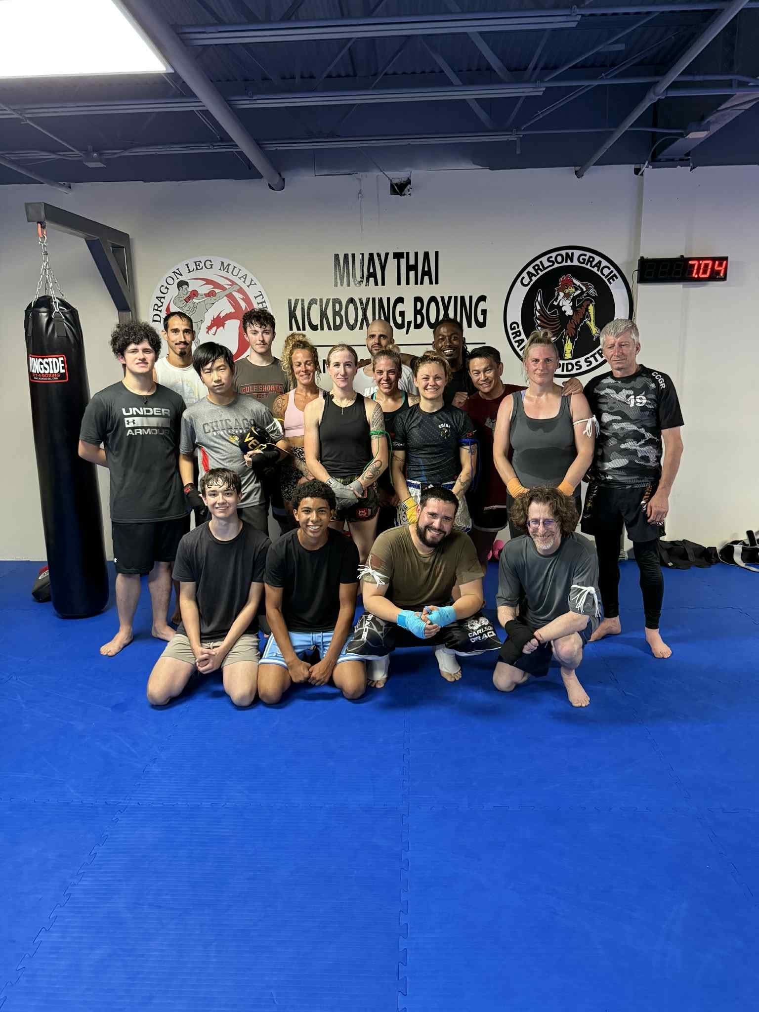 Carlson Gracie Grand Rapids Muay Thai students smiling after class.